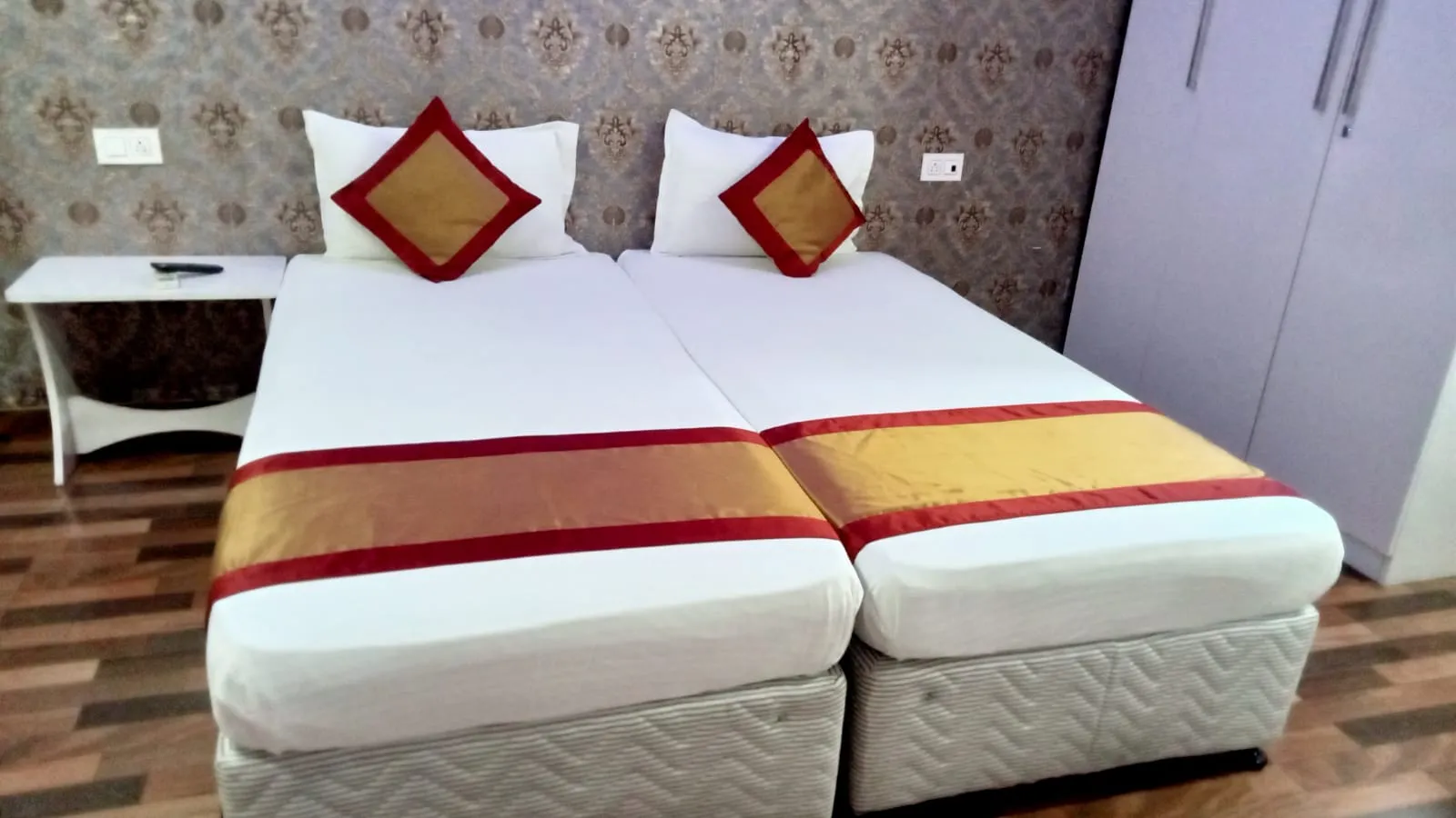 Hotel room with two single beds side by side
